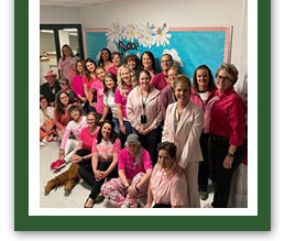 School staff dressed in pink