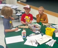 Students at table during summer youth program activities