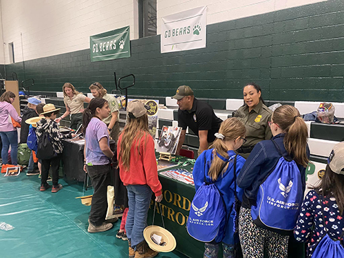 Students in the gym attending a career fair