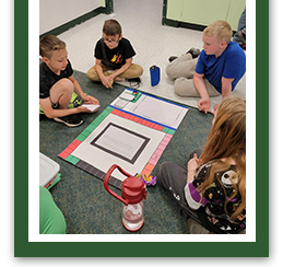 students on the floor working